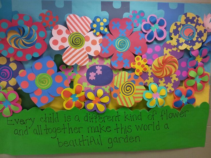 a bulletin board with colorful flowers on it and a quote about every child is a different kind of flower and all together make this world a beautiful garden