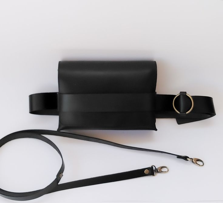 Handmade with genuine leather belt bag in black is here! Black is classy and timeless choice for any season, a black bag is must have in our wardrobe. The new design we have made comes with two straps, so you can wear your new leather bag in two ways, both as a belt bag and a crossbody bag as you wish! UltimaEra *handmade design is a startup business created by women for women, supporting sustainable fashion, you will never miss your new favorite genuine leather bag, and individual unique style of each of us! We are based in Athens - Greece - and every product in our brand is ethical made, designed, handcrafted and produced exclusively by us... So be kind to be patient if sometimes shipping take a little bit longer. Black Shoulder Bag With Removable Belt For On-the-go, Modern Black Belt Bag With Removable Belt, Black Rectangular Belt Bag For Office, Black Belt Bag With Removable Belt For Travel, Classic Black Belt Bag With Removable Pouch, Classic Black Belt Bag With Detachable Strap, Black Crossbody Belt Bag With Removable Belt, Black Leather Shoulder Bag With Belt, Black Leather Shoulder Bag With Belt Detail