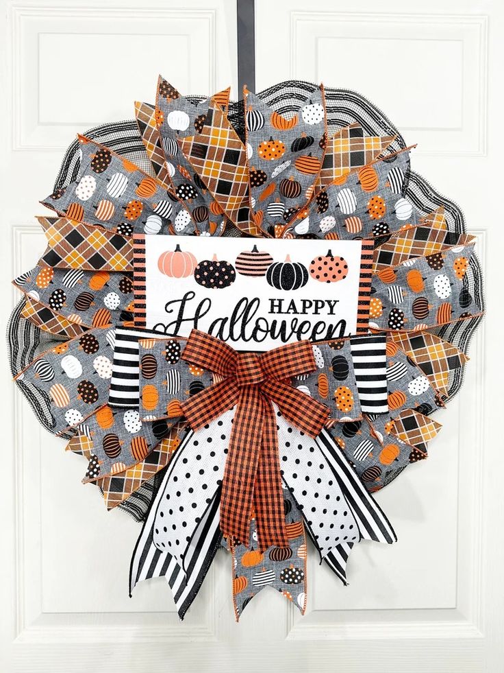 a wreath with the words happy halloween on it