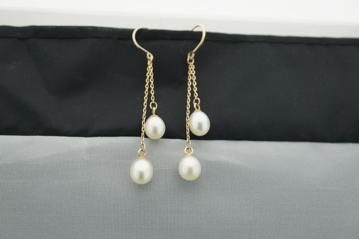 This is the perfect option for those who like cool, unique jewelry and the luxury, shine of gold, white. These earrings are well made, cute and/or elegant in design, and very desirable. The earrings are decorated with natural pearls. The earrings are piercing. The clasps are in good working condition. ♥ Age/Era: Circa before the 2003s. ♥ The earrings have a hallmark. It is 14K.585 ♥ The earrings are about 2'' long. The weight is about 2.3gr. Everyone interested in the jewelry should remember tha White 14k Gold Dangle Jewelry, White Briolette Fine Jewelry Earrings, White 14k Gold Drop Jewelry, Classic White Briolette Earrings, White Teardrop 14k Gold Earrings, White 14k Gold Teardrop Earrings, Elegant Hypoallergenic 14k Gold Pearl Earrings, Hypoallergenic White Gold 14k Pearl Earrings, Dainty White 14k Gold Pearl Earrings