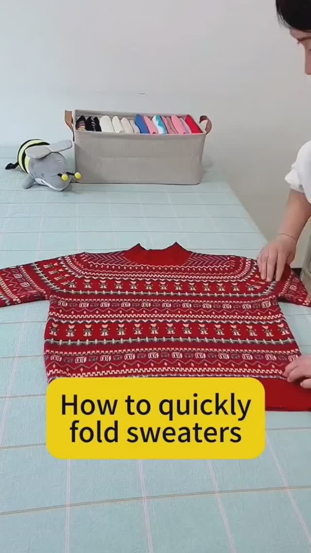 a woman is working on a sweater with the words how to quickly fold sweaters