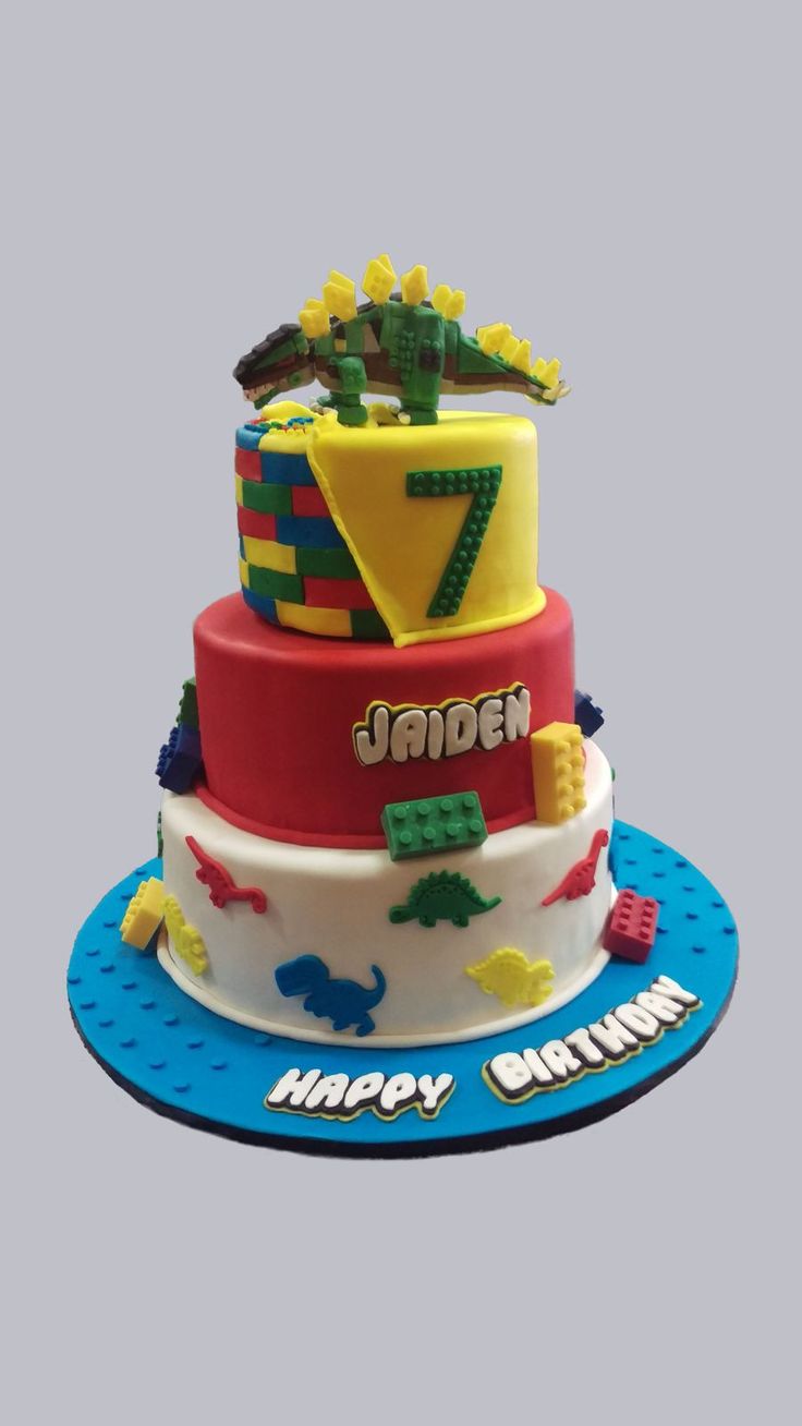 a birthday cake made to look like legos with the number seven on it's side