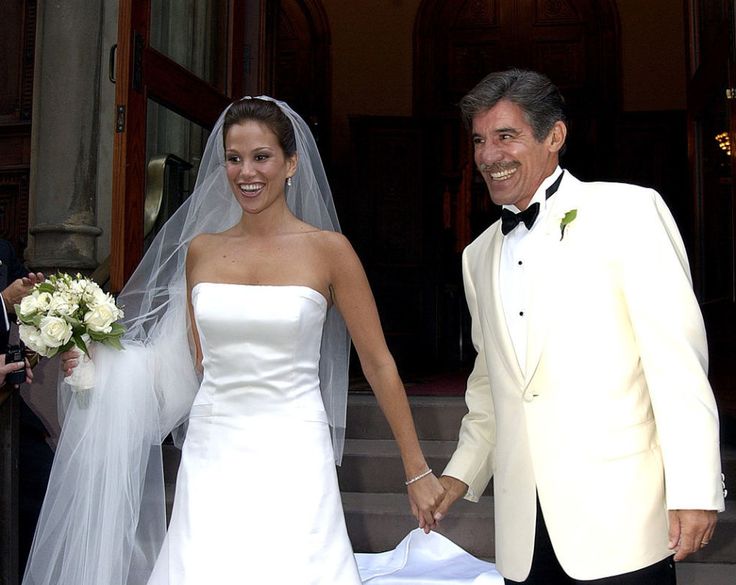 a bride and groom walking down the steps