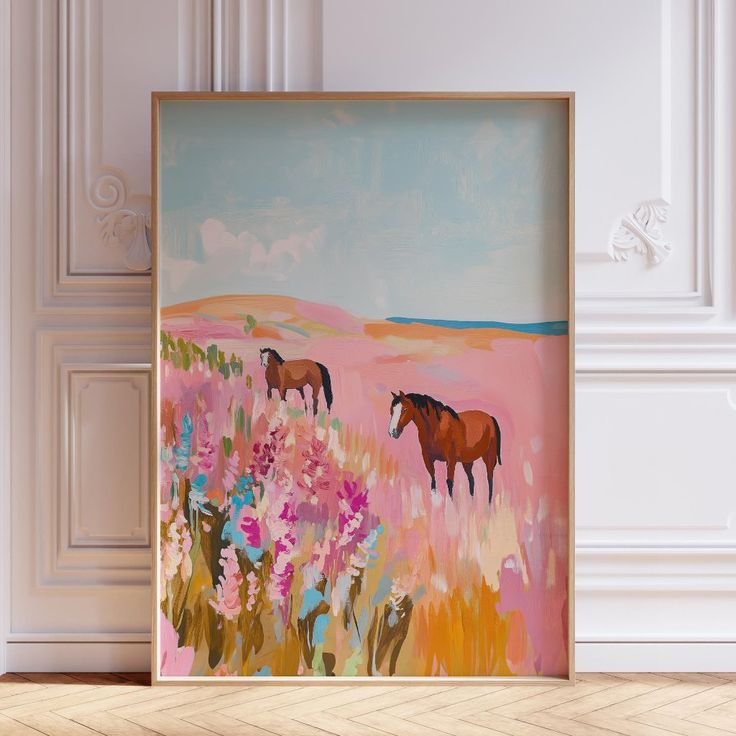 two horses are standing in a field with flowers