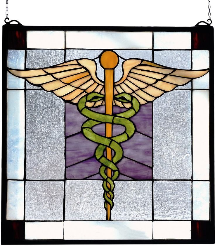 a stained glass window with a cadus symbol on it