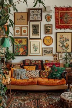 a living room filled with lots of pictures on the wall