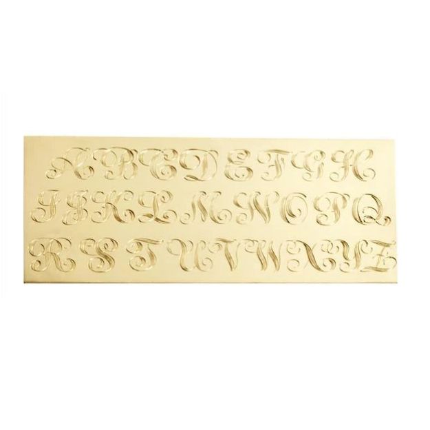 a carved plaque with the letters and numbers in cursive font, on a white background