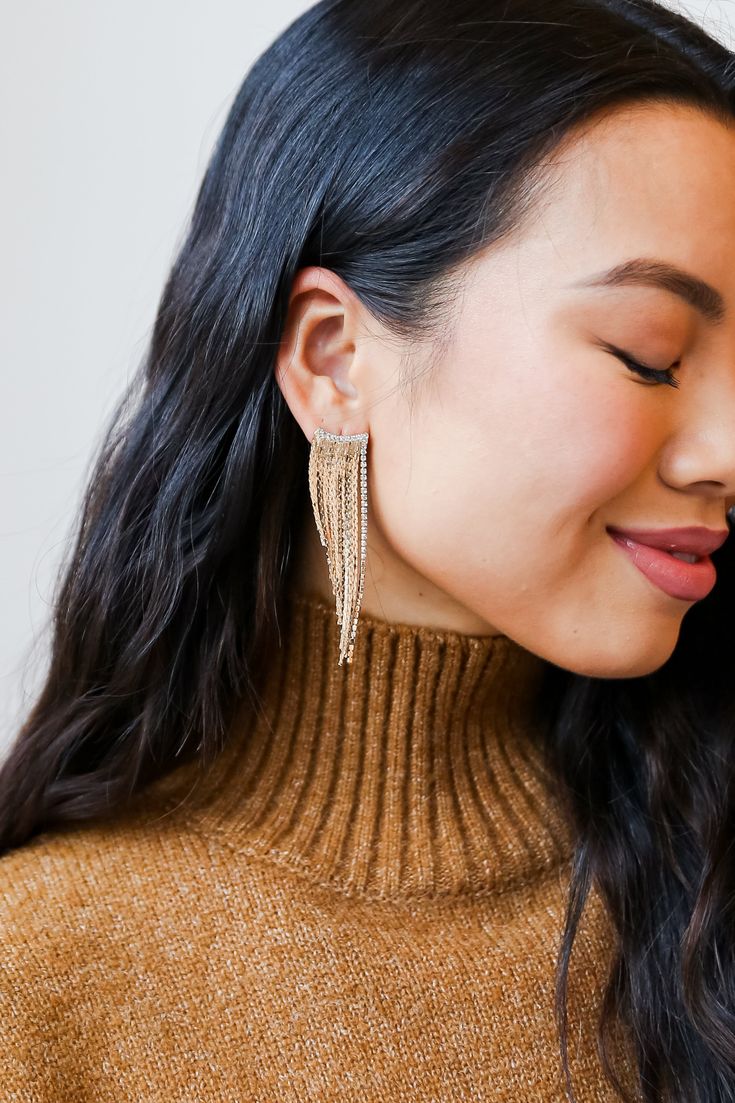 From cocktail hour to date night, the Riley Gold Rhinestone Fringe Earrings has everything you need to create a radiant outfit! These trendy gold earrings feature a stud post back with gold chain fringe + rhinestones! Style the Riley Earrings with a maxi dress + booties for a girly fall look! Gold Plated Rhinestones Fringe Stud Post Back One Size | Length 2.75” Diamante Earrings, Shoulder Duster Earrings, Duster Earrings, Dress Booties, Rhinestone Fringe, Lanyard Necklace, Chain Fringe, Kids Earrings, Trendy Earrings