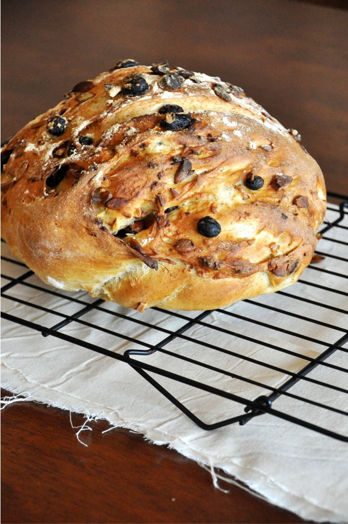 a loaf of bread sitting on top of a cooling rack