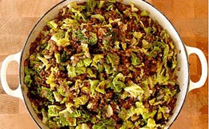 a pot filled with lots of food on top of a wooden table