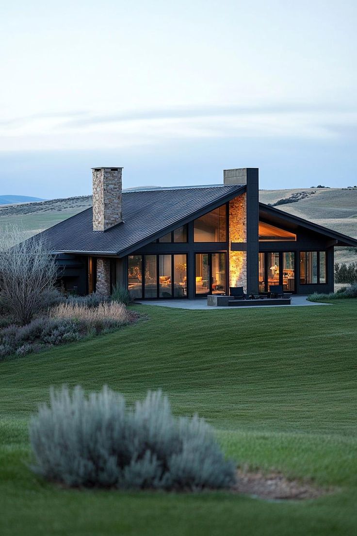 a modern house in the middle of an open field