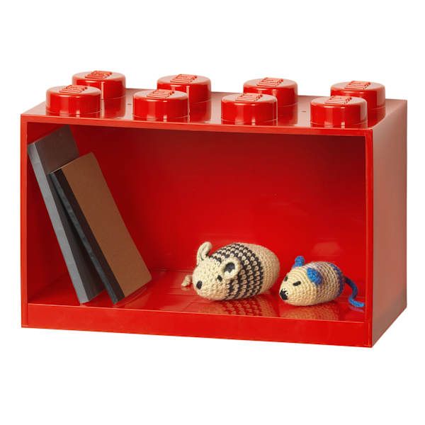 a lego shelf with two stuffed animals on it