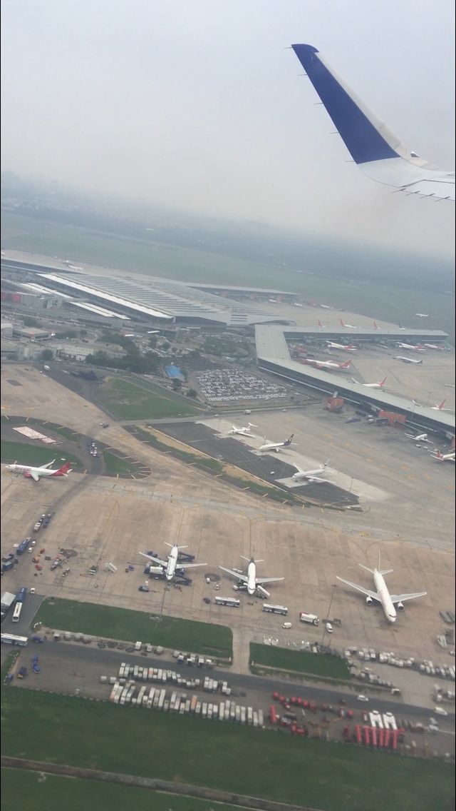 an aerial view of the airport with several planes