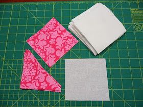 three pieces of fabric sitting on top of a cutting board