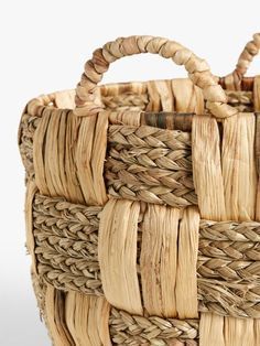 a close up of a woven basket on a white background