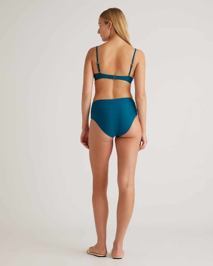 This bikini bottom is a triple threat: It was made to last, made with Italian-crafted fabric, and thoughtfully made with recycled materials. With a high-rise design, medium cut leg, and full lining, you'll get the moderate backside coverage and timeless style you're looking for. Resists fading, pilling, and snagging, so you'll be wearing it for years to come.  | Quince | Women's Italian High-Rise Bikini Bottom in Teal, Size XS, 78% Recycled Polyamide, 22% Spandex Seamless Underwire Bottoms For Sunbathing, Nylon Brief Swimwear With Lined Body, Nylon Swimwear Briefs With Moderate Back Coverage, Swim Bottoms With Built-in Bra, Beachwear Bottoms With Built-in Bra And Underwire, Micro-elastic Underwire Swimwear For The Beach, Beachwear Swimwear With Moderate Back Coverage, Bra-friendly Brief Swimwear For Beachwear, Poolside Swimwear With Moderate Back Coverage