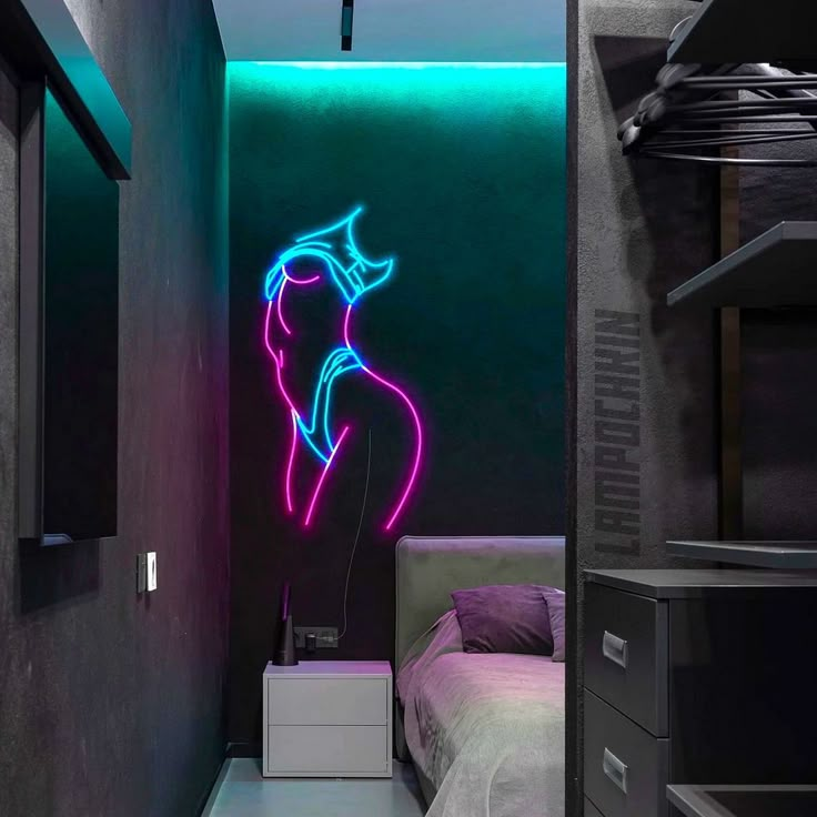 a bedroom with a neon light painting on the wall