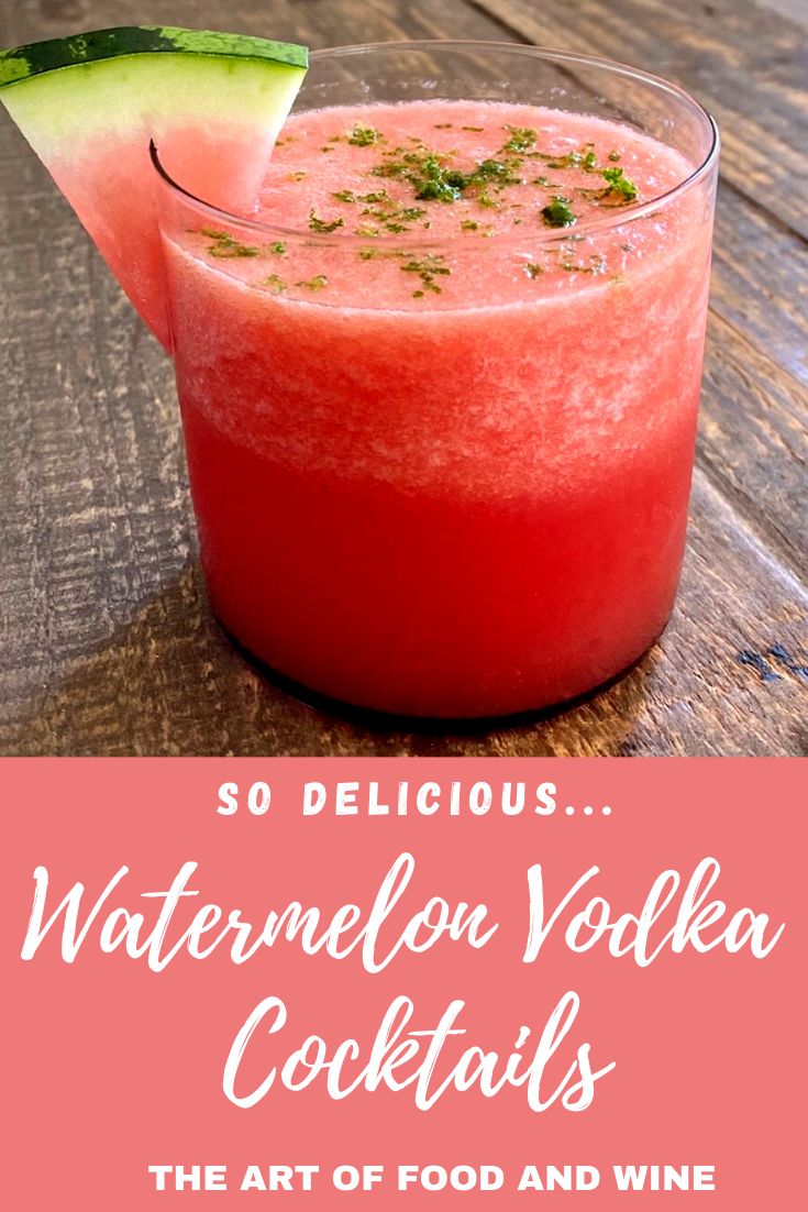 watermelon vodka cocktail in a glass with a slice of cucumber on top