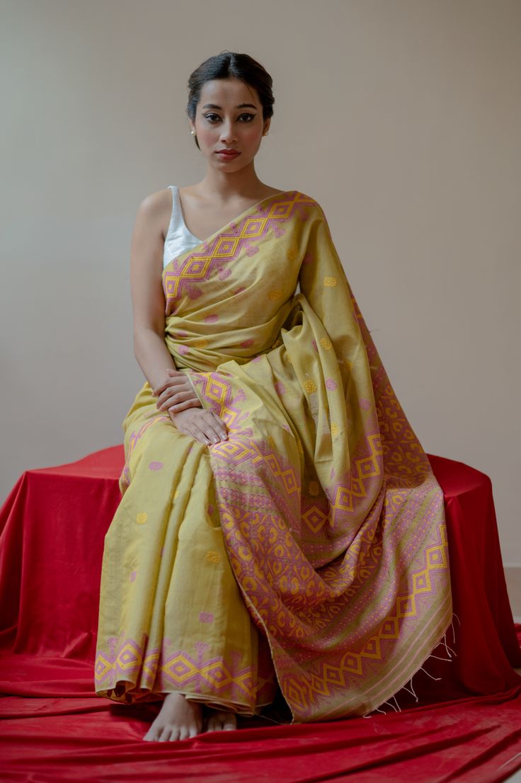 Adorned with floral and geometric tribal motifs, this refreshing and spring-ready Eri Kesa Paat silk saree in pastel green, and a time-consuming maku mara border, exudes everlasting grace. Featuring a beautifully detailed pallu bedecked with perennial hues of pink and yellow meenakari in its graceful folds. A fabulous statement piece designed keeping in mind summer weddings and festivities. Pastel Green, Mulberry Silk, Silk Sarees, Summer Wedding, Saree, Silk, Yellow, Festival, Pink