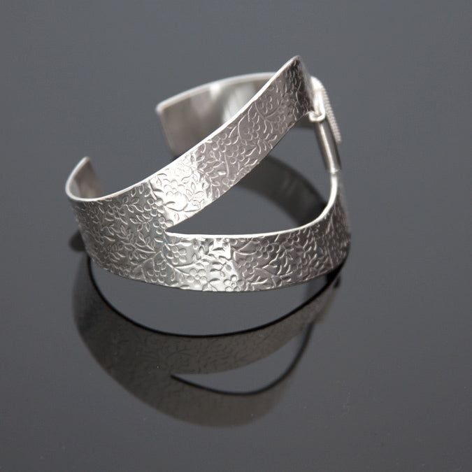 .925 Sterling Silver Fits wrist size 6" to 6 3/4" Handmade using goldsmith techniques Luxury Adjustable Bracelet With Open Band, Luxury Adjustable Open Band Bracelet, Hand Forged Bangle For Formal Occasions, Formal Hand Forged Bangle Jewelry, Formal Hand-forged Bangle Jewelry, Modern Hand Forged Bangle Jewelry, Modern Hand Forged Bangle, Elegant Adjustable Hand Forged Cuff Bracelet, Adjustable Open Band Bracelet With Polished Finish