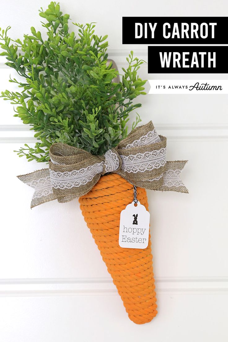 an orange carrot hanging on the side of a door with a tag that says diy carrot wreath