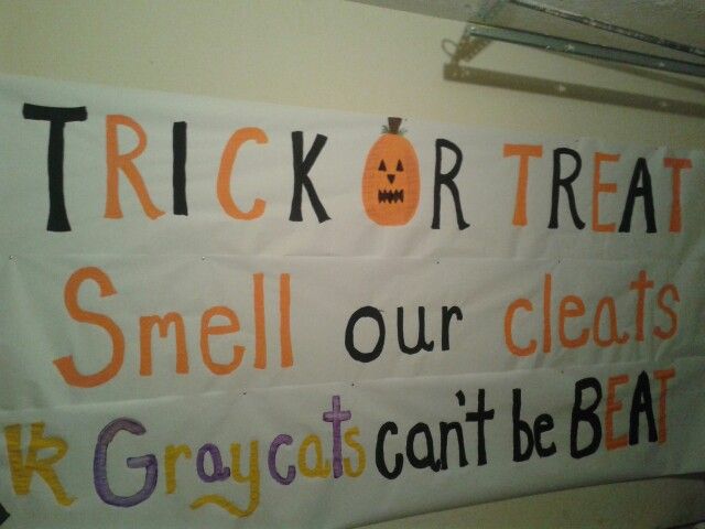 a trick or treat sign hanging on the wall