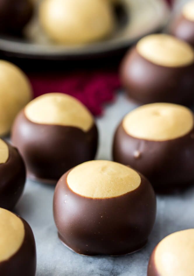 chocolate covered desserts sitting on top of a table