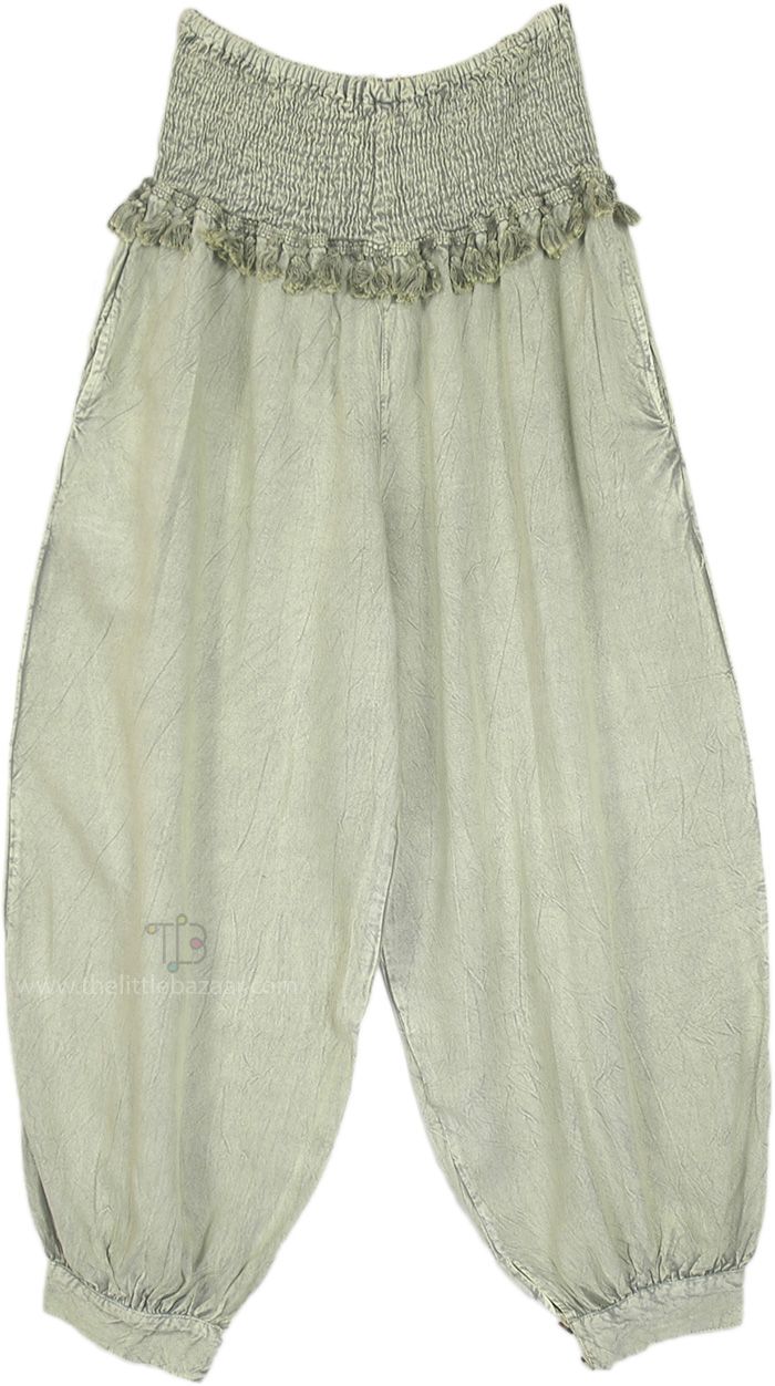 These harem-style (or Patiala-style) boho pants are made from soft, breathable rayon, offering a comfortable and flowy fit in a one-size design that suits a variety of body shapes.  The smocked waistband provides stretch and comfort and is adorned with delicate tassel fringe detailing that adds a unique bohemian touch. #tlb #SplitSkirtsPants #Summerpants Solid Color Harem Bottoms For Summer, Spring Ankle-length Harem Pants For Loungewear, Spring Harem Pants For Loungewear, Ankle-length, Bohemian Solid Color Harem Pants For Vacation, Casual Flowy Harem Pants For Spring, Bohemian Harem Pants With Pockets For Spring, Solid Bohemian Bottoms For Spring, Solid Bohemian Ankle-length Pants, Bohemian Style Bottoms In Solid Color With Relaxed Fit