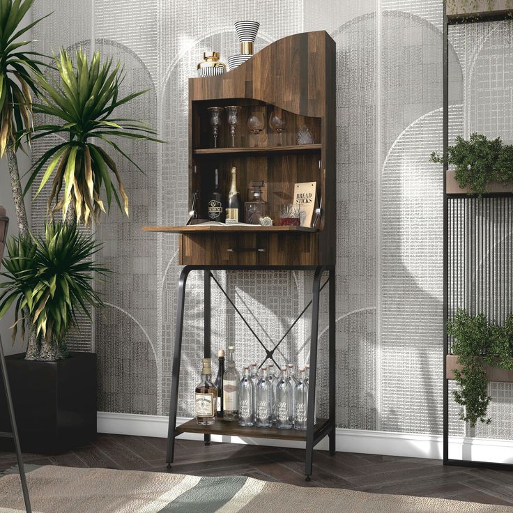 a wooden desk sitting next to a potted plant