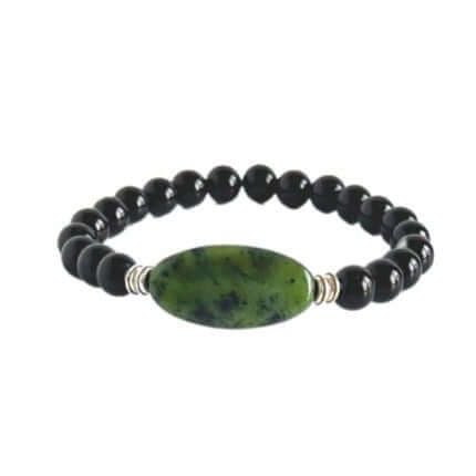 Jade Focal Bracelet This bracelet is made with high-quality Jade and either Black Onyx or Obsidian stones which bring calm and insight to the wearer. Zodiac Signs: Capricorn Onyx Gemstone Beads Jewelry For Healing, Onyx Bead Jewelry For Healing, Spiritual Obsidian Round Bead Jewelry, Spiritual Obsidian Jewelry With Round Beads, Spiritual Onyx Jewelry With Gemstone Beads, Bohemian Black Stretch Bracelet With Gemstone Beads, Elegant Black Jade Jewelry, Spiritual Onyx Beads Jewelry 8mm, Adjustable Spiritual Onyx Jewelry