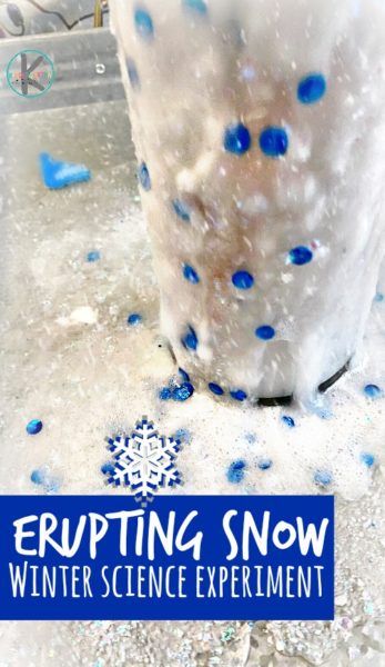 an ice bucket filled with blue and white sprinkles on top of snow