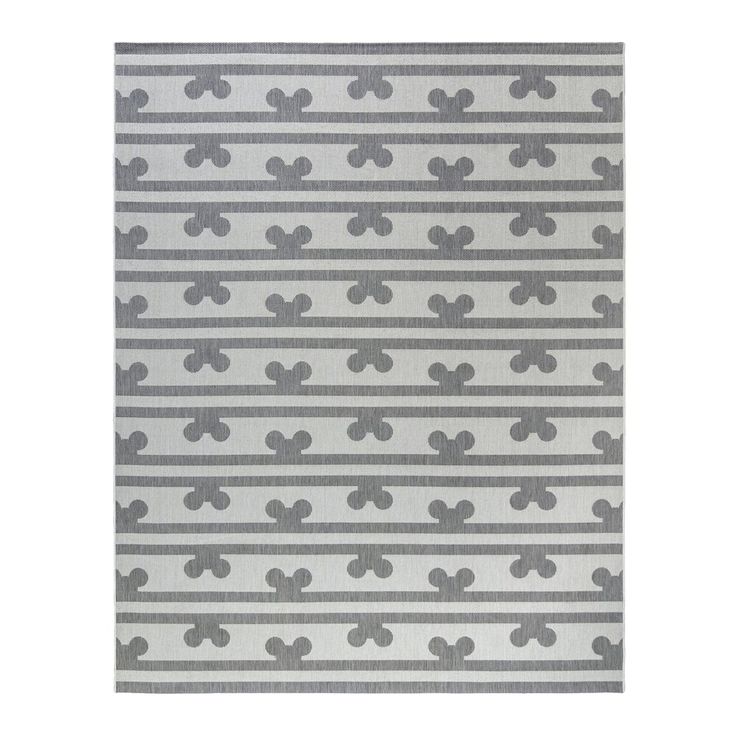 a gray and white rug with small grey crosses on it