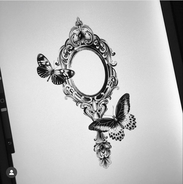 a black and white drawing of a mirror with butterflies on it's side,