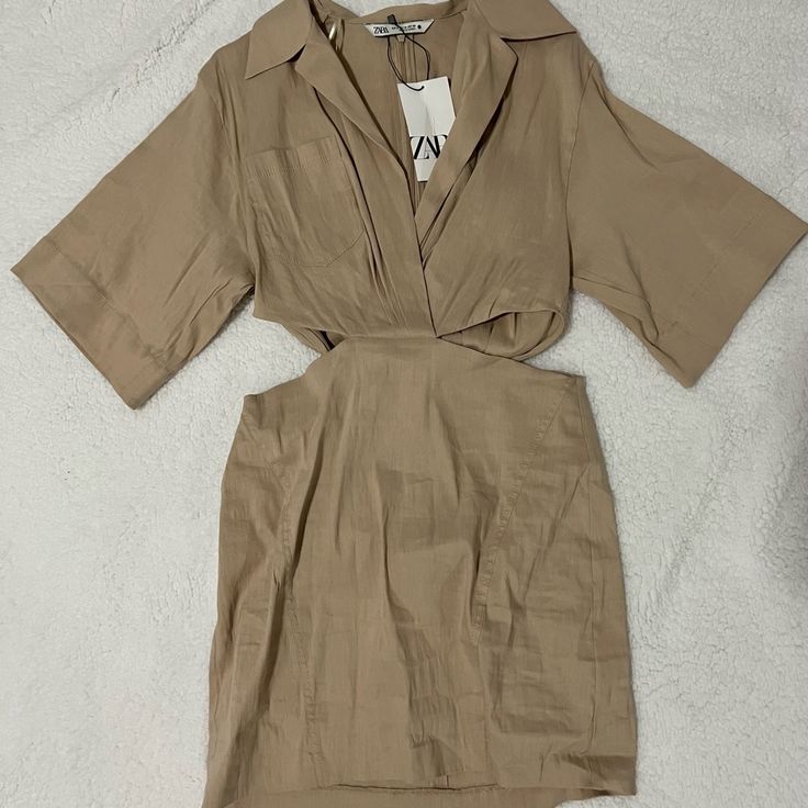 Brand New Zara Dress Size Medium Very Fashionable And Sexy. Zara Beige Mini Dress For Day Out, Chic Brown Mini Dress By Zara, Brown Short Sleeve Mini Dress For Night Out, Brown Short Sleeve Midi Dress For Date Night, Summer Khaki V-neck Midi Dress, Spring Beige Mini Dress With Short Sleeves, Beige Cutout Summer Dress, Beige Short Sleeve Midi Dress, Beige Cutout Dress For Summer