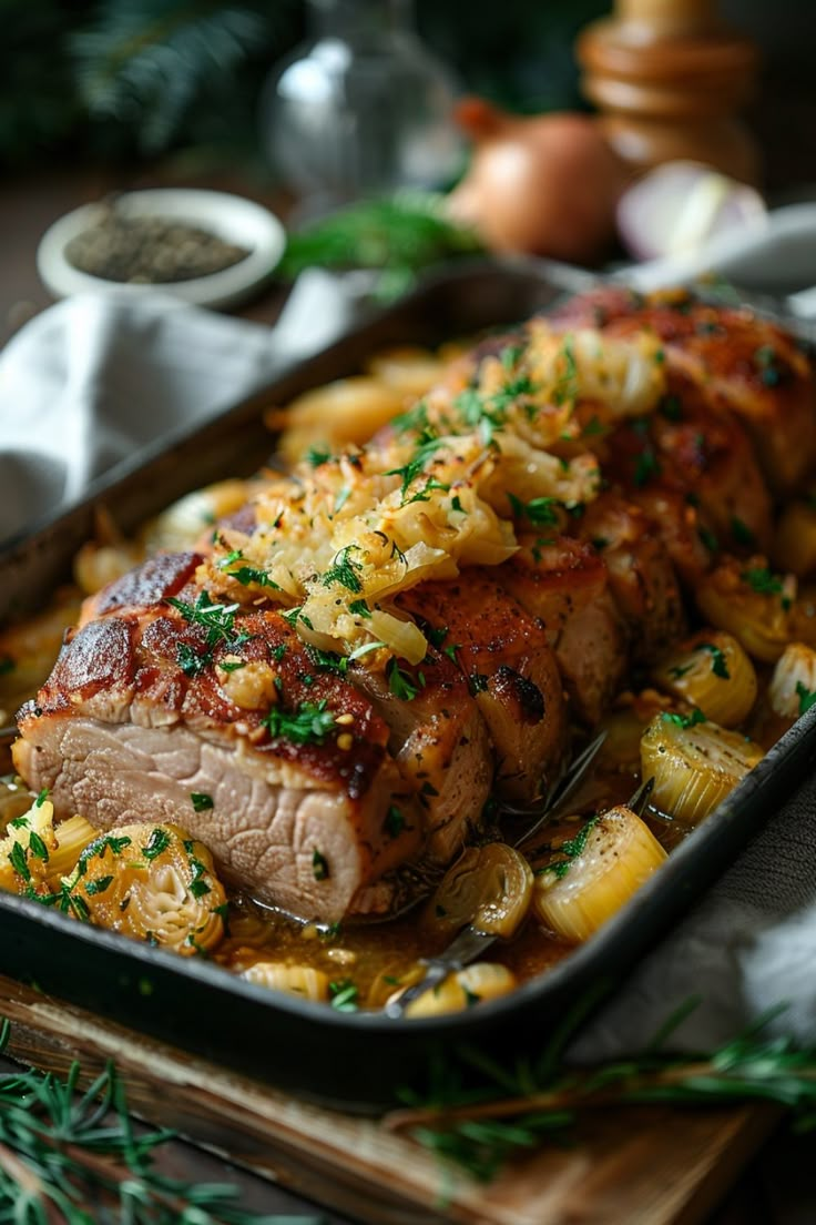 Roasted pork loin garnished with caramelized onions and fresh herbs in a baking dish. Pork Tenderloin With Sauerkraut, Pork Loin With Sauerkraut, Oven Roasted Pork Loin, Pork And Sauerkraut Recipe, Oven Roasted Pork Tenderloin, Oven Roasted Pork, Pork And Sauerkraut, Roasted Pork Loin, Pork Roast In Oven