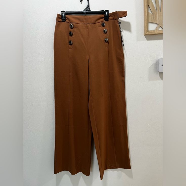 Nwt. Tan Bell Bottom Slacks With 6 Buttons In Front. Brown Dress Pants With Belt Loops For Office, Brown Ankle-length Dress Pants For Office, Brown Wide Leg Ankle-length Workwear Pants, High Waist Wide Leg Brown Pants For Office, Brown High Waist Wide Leg Pants For Office, High Waist Brown Wide Leg Pants For Office, Brown Ankle-length Wide Leg Pants For Work, Brown Wide-leg Pants For Office, Brown Ankle-length Office Pants