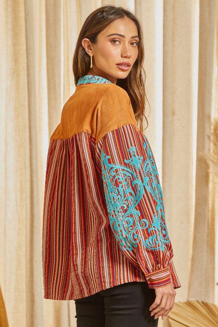 This beautiful striped pattern blouse features a suede panel with lace up detail. This top features gorgeous embroidery with long sleeves. One of a kind. Non sheer, woven. Brown Patchwork Long Sleeve Blouse, Brown Floral Embroidered Long Sleeve Top, Spring Striped Long Sleeve Blouse, Brown Long Sleeve Top With Floral Embroidery, Spring Blouse With Striped Long Sleeves, Spring Long Sleeve Blouse With Striped Sleeves, Brown Floral Embroidered Blouse For Fall, Brown Embroidered Long Sleeve Blouse, Brown Floral Embroidery Blouse For Fall