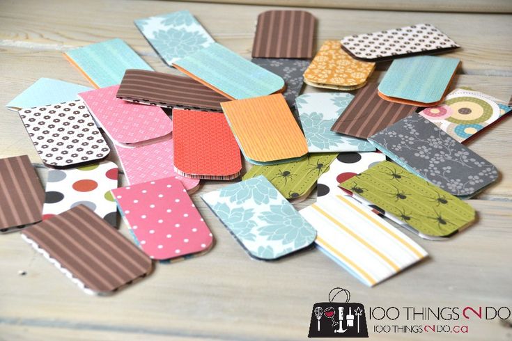 several pieces of fabric are arranged together on a wooden surface with polka dots and stripes