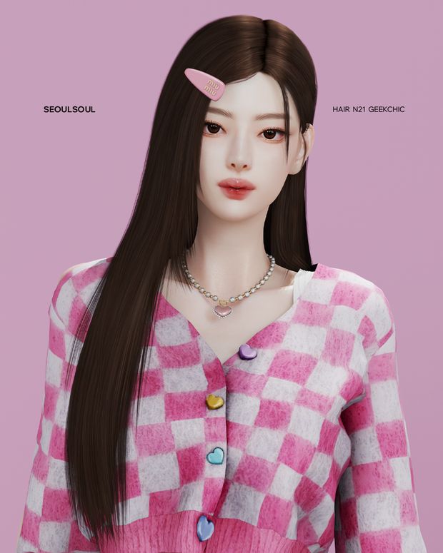 a woman with long brown hair wearing a pink and white sweater