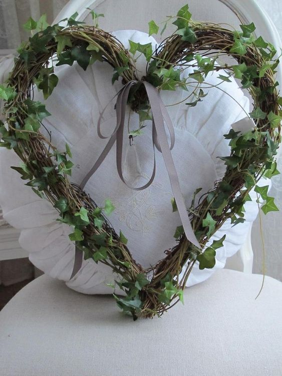 a heart shaped wreath on top of a chair