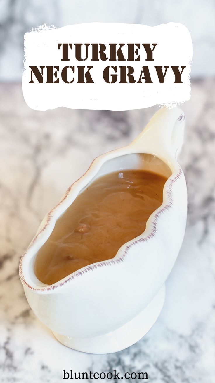 a white bowl filled with gravy sitting on top of a counter