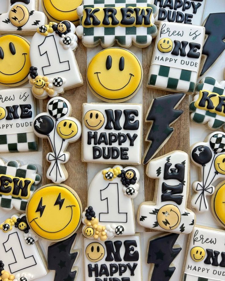 decorated cookies with smiley faces and words on them