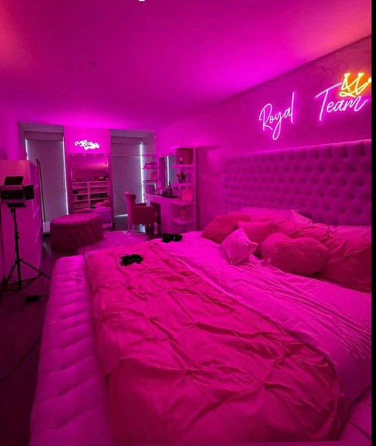 a bed with pink lights in a room