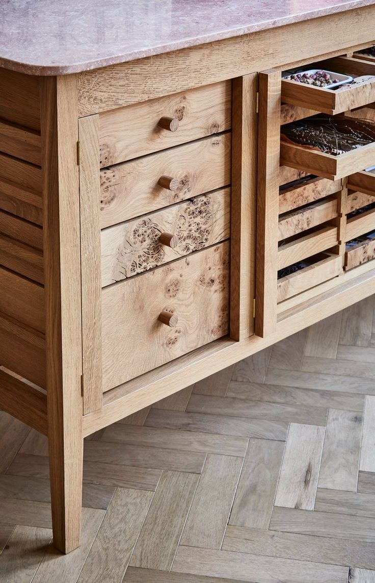 a large wooden cabinet with drawers on it