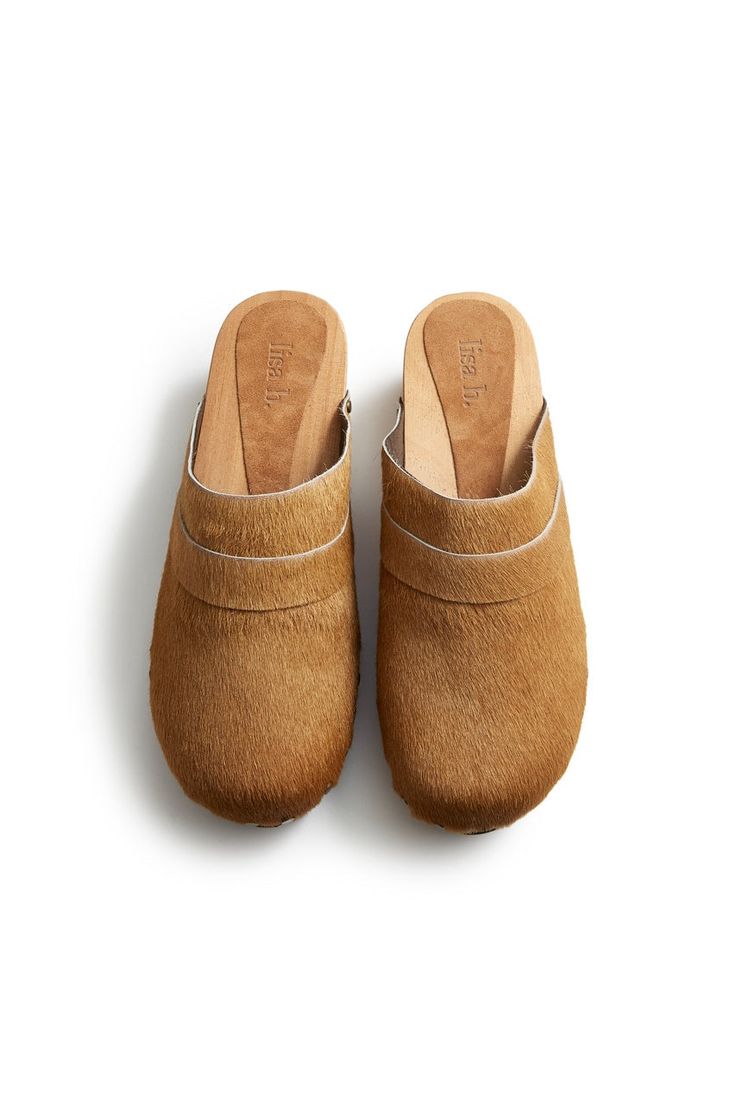 Cow hair classic low heel leather clogs in camel. Comfortable 1 7/8" pine wood mid heel. Leather lined. Made in Spain. Fit is true to size. Half sizes should order up. Save SaveSave Brown Mules With Low Wooden Heel, Brown Mules With Stacked Low Heel, Brown Low Heel Mules With Stacked Heel, Brown Clogs With Wooden Low Heel, Brown Low Heel Clogs With Removable Insole, Classic Brown Low Heel Mules, Brown Suede-lined Clogs With Round Toe, Shoe Repair Shop, Leather Clog