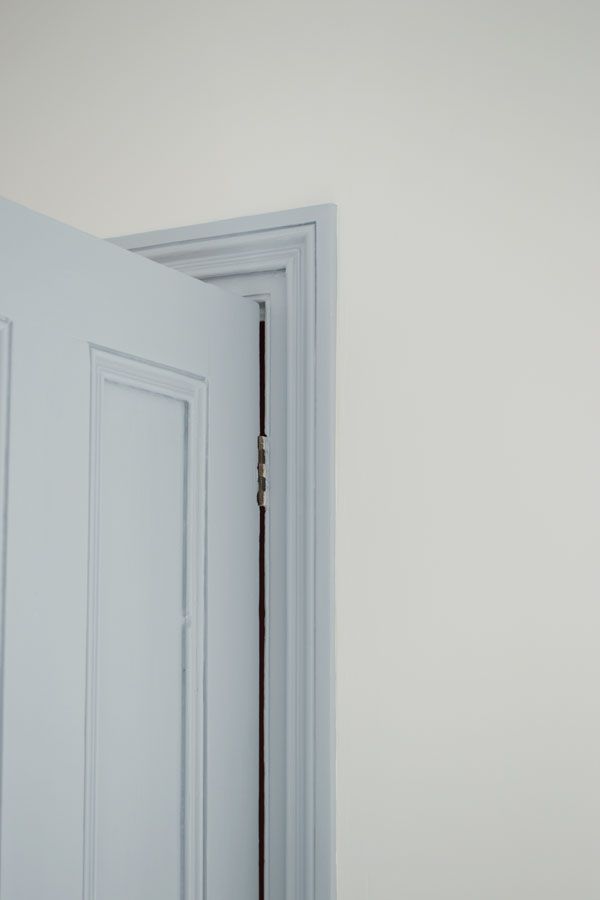 an open door in a white room