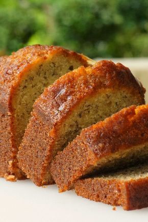 sliced loaf of banana bread sitting on top of a white plate