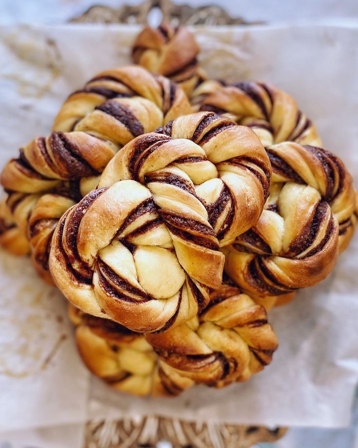 several braided pastries sitting on top of each other