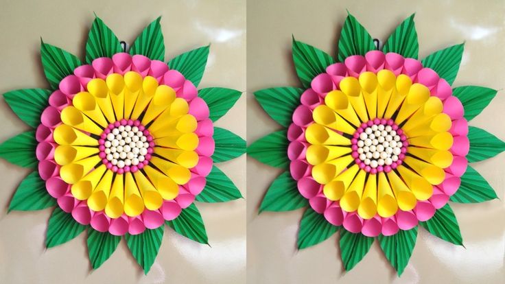 two pictures of flowers made out of paper