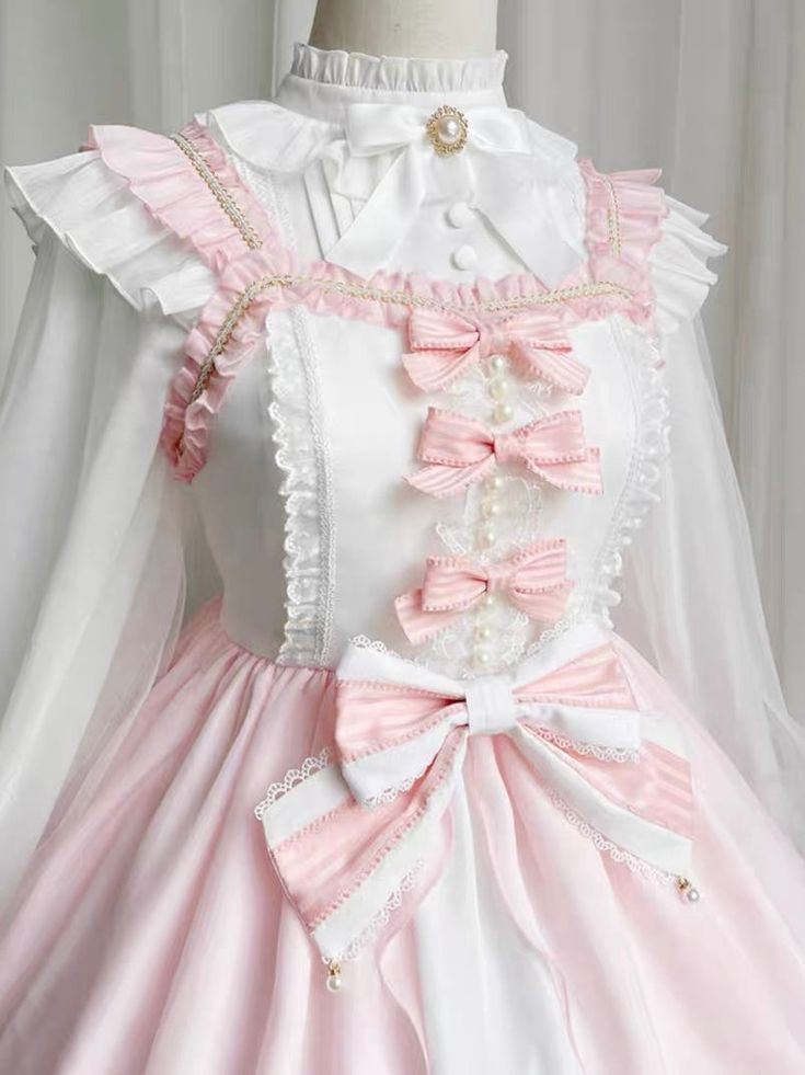 Pink Bow Lolita Sweet Dress Elevate your style with the Pink Bow Lolita Sweet Dress. Featuring a delicate pink bow, this dress exudes elegance and sweetness. Made from high-quality materials, it offers both comfort and style. Perfect for any occasion, it is sure to make a statement and turn heads. Size Chart (cm) ? Bust Shoulder Width Dress Length Top Length? L 96 37 106 57 XL 102 38 107 58 2XL 108 39 108 59 3XL 114 40 109 60 4XL 120 41 110 61 White Sleeveless Kawaii Dress, Pink Feminine Dresses With Bow Straps, Feminine Pink Dress With Bow Straps, Feminine Pink Dresses With Bow Straps, Kawaii Dresses With Bow, Pink Spring Dress With Bow, Sweet White Dress With Ruffles, Sweet White Ruffled Dress, White Sweet Doll Collar Dress